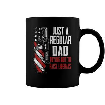 Just A Regular Dad Trying Not To Raise Liberals -- On Back Coffee Mug | Mazezy