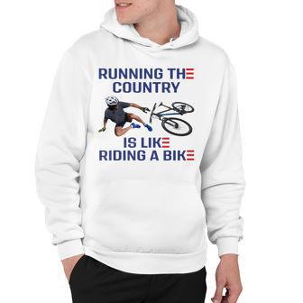 Running The Country Is Like Riding A Bike Flag Biden Falls Hoodie - Thegiftio UK