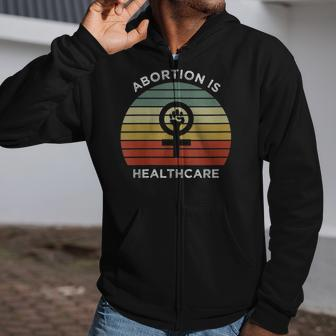 Womens Abortion Is Healthcare For Feminist Feminism Pro-Abortion V-Neck Zip Up Hoodie | Mazezy