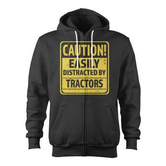 Caution Easily Distracted By Tractors - Funny Tractor Lover Zip Up Hoodie | Mazezy