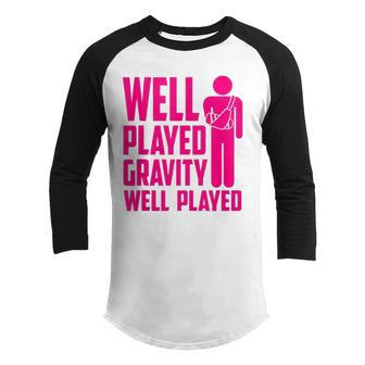 Cool Broken Arm Gift For Kids Funny Gravity Gag Broke Bone Youth Raglan Shirt | Mazezy