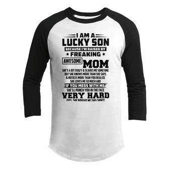 I Am A Lucky Son Because Im Raised By A Freaking Awesome Mom Shes A Bit Crazy And Scares Me Youth Raglan Shirt | Favorety CA