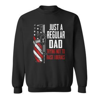 Just A Regular Dad Trying Not To Raise Liberals -- On Back Sweatshirt | Mazezy