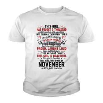 November Girl This Girl Has Fought A Thousand Battles And Is Still Standing Youth T-shirt - Thegiftio UK