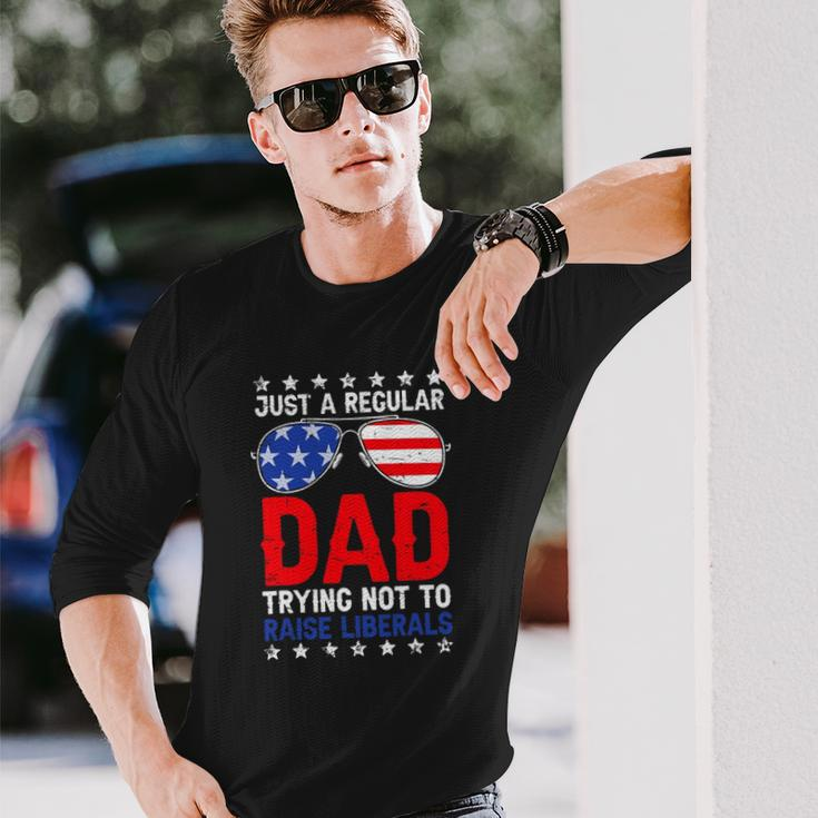 Just A Regular Dad Trying Not To Raise Liberals Voted Trump Long Sleeve T-Shirt T-Shirt Gifts for Him