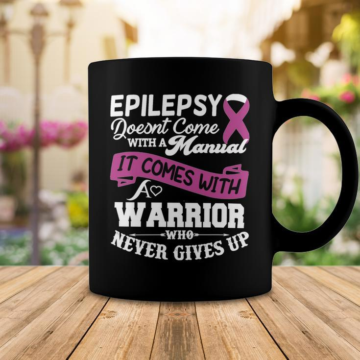 Epilepsy Doesnt Come With A Manual It Comes With A Warrior Who Never Gives Up Purple Ribbon Epilepsy Epilepsy Awareness Coffee Mug Unique Gifts