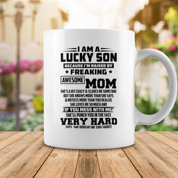 I Am A Lucky Son Because Im Raised By A Freaking Awesome Mom Shes A Bit Crazy And Scares Me Coffee Mug Funny Gifts