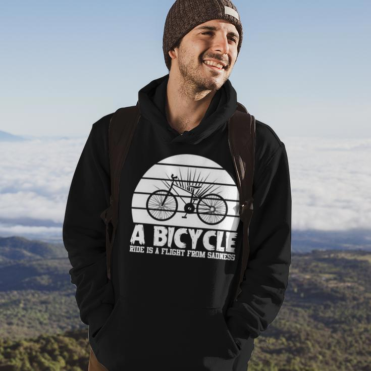 Funny Bicycle I Ride Fun Hobby Race Quote A Bicycle Ride Is A Flight From Sadness Hoodie Lifestyle