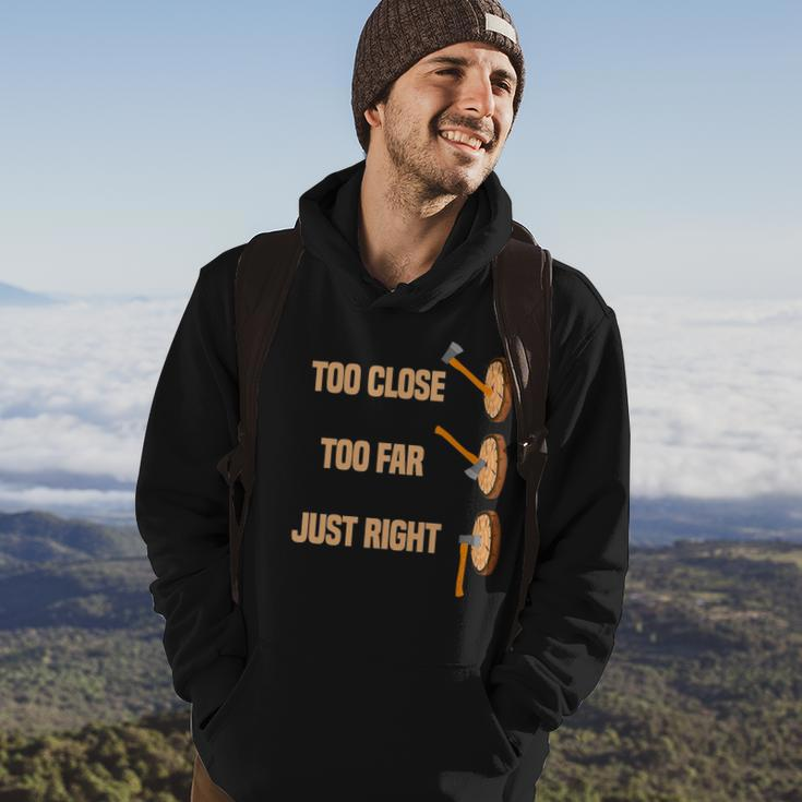 Mens Too Close Too Far Just Right Axe Throwing Funny Axe Thrower Hoodie Lifestyle