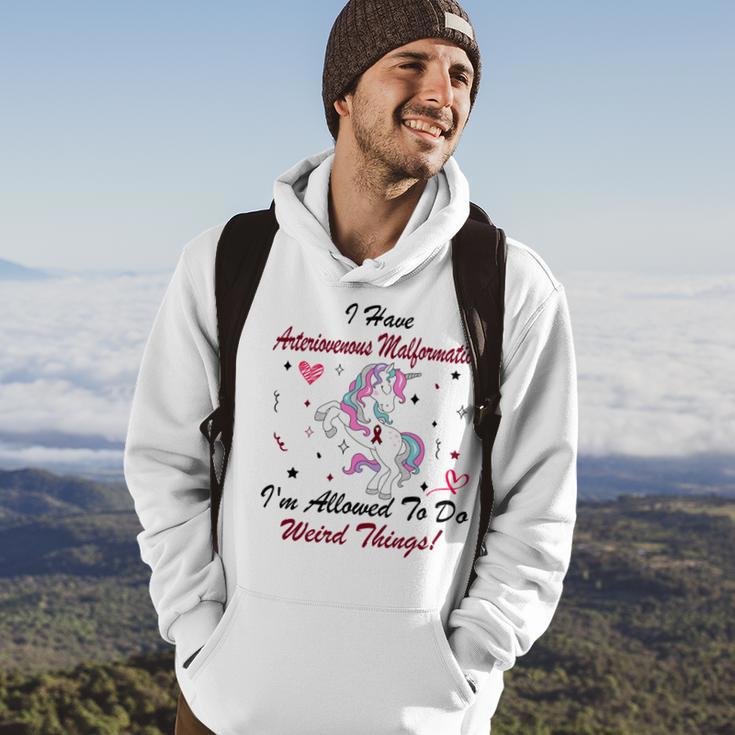 I Have Arteriovenous Malformation Im Allowed To Do Weird Things Funny Unicorn Burgundy Ribbon Arteriovenous Malformation Support Arteriovenous Malformation Awareness Hoodie Lifestyle