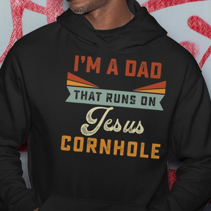 Mens Im A Dad That Runs On Jesus Cornhole Christian Vintage Gift Hoodie Unique Gifts