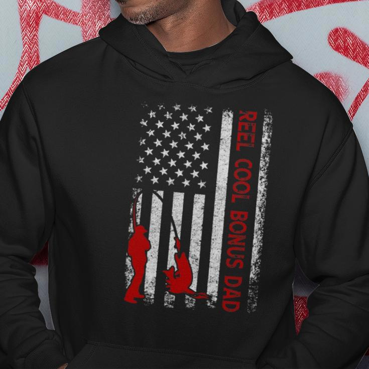Reel Cool Bonus Dad American Flag Fishing Fathers Day Hoodie Unique Gifts
