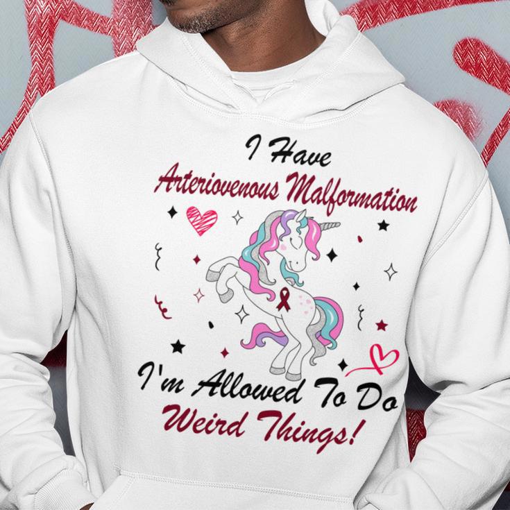 I Have Arteriovenous Malformation Im Allowed To Do Weird Things Funny Unicorn Burgundy Ribbon Arteriovenous Malformation Support Arteriovenous Malformation Awareness Hoodie Funny Gifts