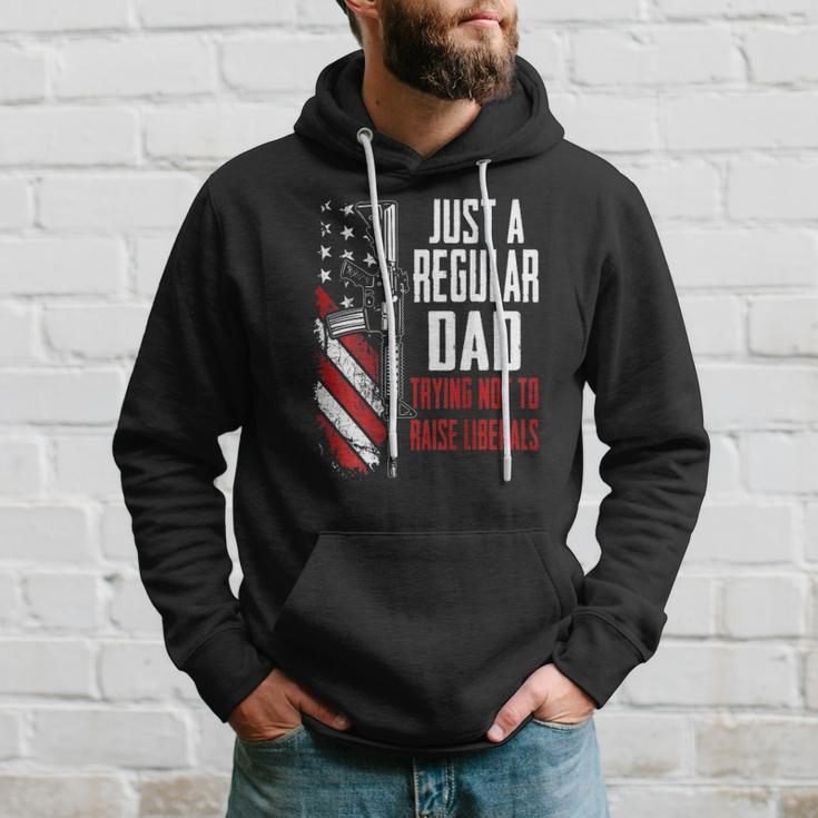 Just A Regular Dad Trying Not To Raise Liberals -- On Back Hoodie Gifts for Him