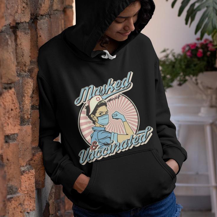 Masked And Vaccinated - Educated Vaccinated Caffeinated Dedicated Vintage Nurse Life Youth Hoodie