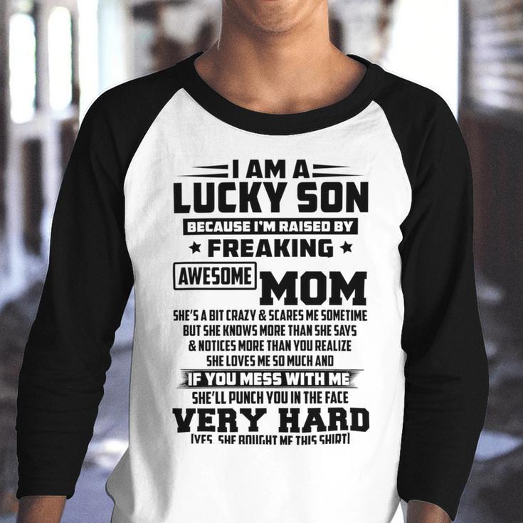 I Am A Lucky Son Because Im Raised By A Freaking Awesome Mom Shes A Bit Crazy And Scares Me V2 Youth Raglan Shirt