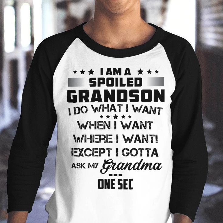 I Am A Spoiled Grandson I Do What I Want When I Want Where I Want Except I Gotta Ask My Grandma One Sec V2 Youth Raglan Shirt