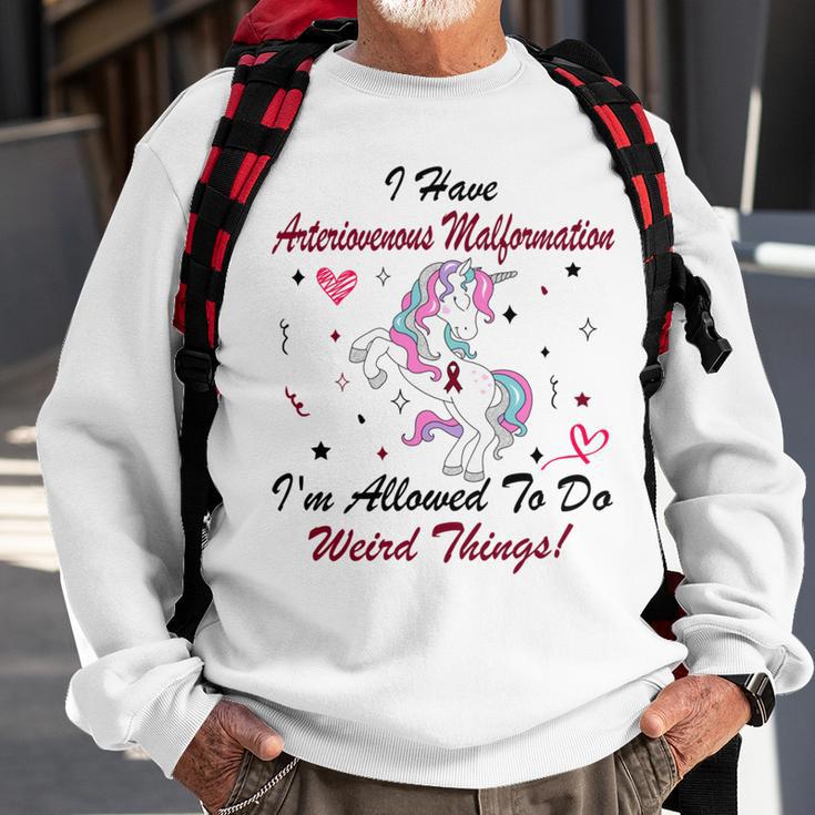 I Have Arteriovenous Malformation Im Allowed To Do Weird Things Funny Unicorn Burgundy Ribbon Arteriovenous Malformation Support Arteriovenous Malformation Awareness Sweatshirt Gifts for Old Men