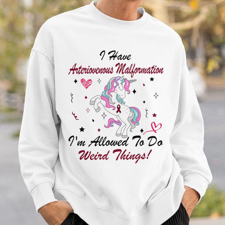 I Have Arteriovenous Malformation Im Allowed To Do Weird Things Funny Unicorn Burgundy Ribbon Arteriovenous Malformation Support Arteriovenous Malformation Awareness Sweatshirt Gifts for Him