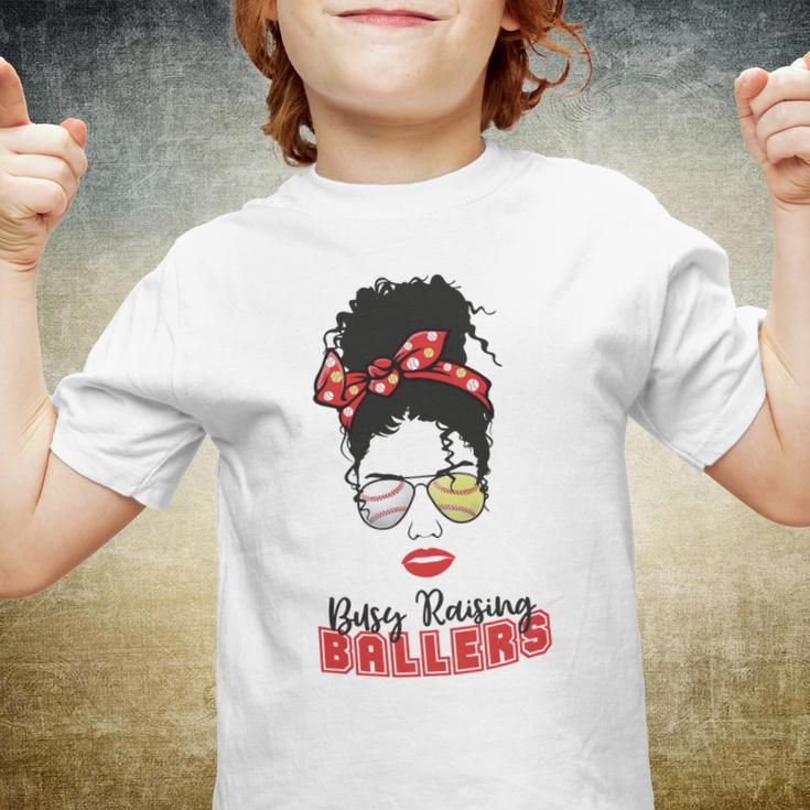 Baseball Busy Raising Ballers Momlife Mom Messy Bun Afro Mom Mothers Day Youth T-shirt