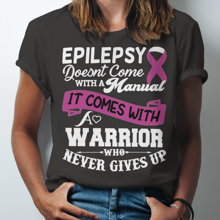 Epilepsy Doesnt Come With A Manual It Comes With A Warrior Who Never Gives Up Purple Ribbon Epilepsy Epilepsy Awareness Unisex Jersey Short Sleeve Crewneck Tshirt