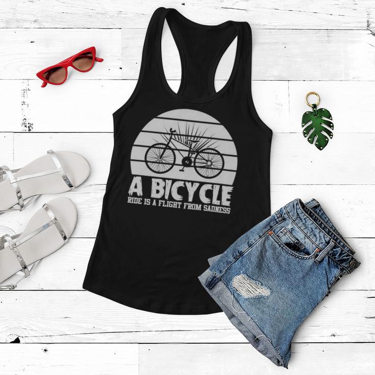 Funny Bicycle I Ride Fun Hobby Race Quote A Bicycle Ride Is A Flight From Sadness Women Flowy Tank