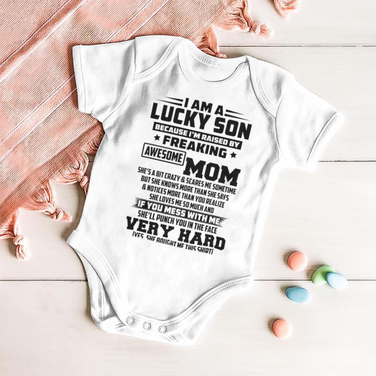 I Am A Lucky Son Because Im Raised By A Freaking Awesome Mom Shes A Bit Crazy And Scares Me V2 Baby Onesie